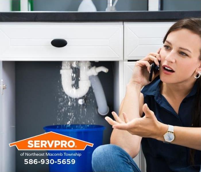 A person calls for help for a water damage emergency.